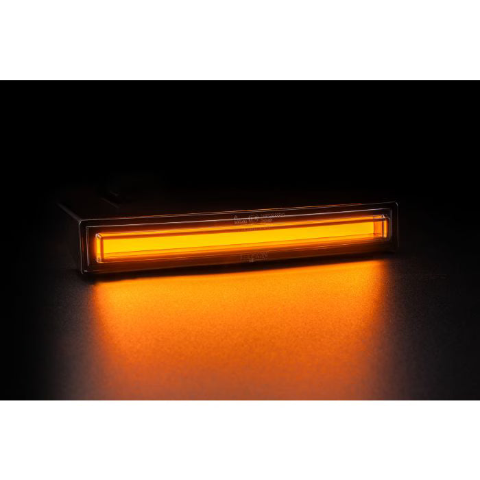 LEDSON Optoline NG+ med gult lys mod sort baggrund